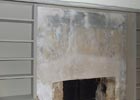 Chimney breast restoration with lime plaster