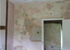Internal lime plaster repairs to a damaged wall